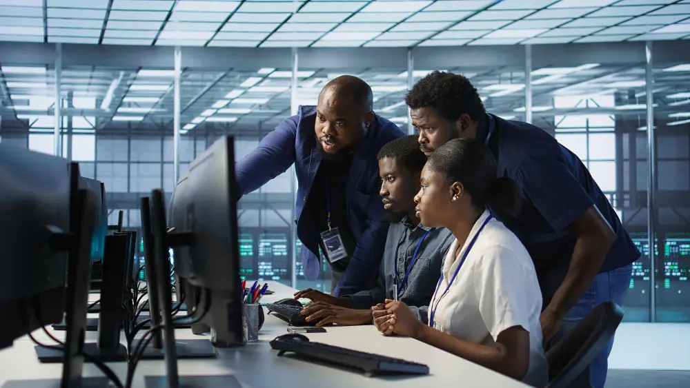 Happy team collaborating on technology solutions